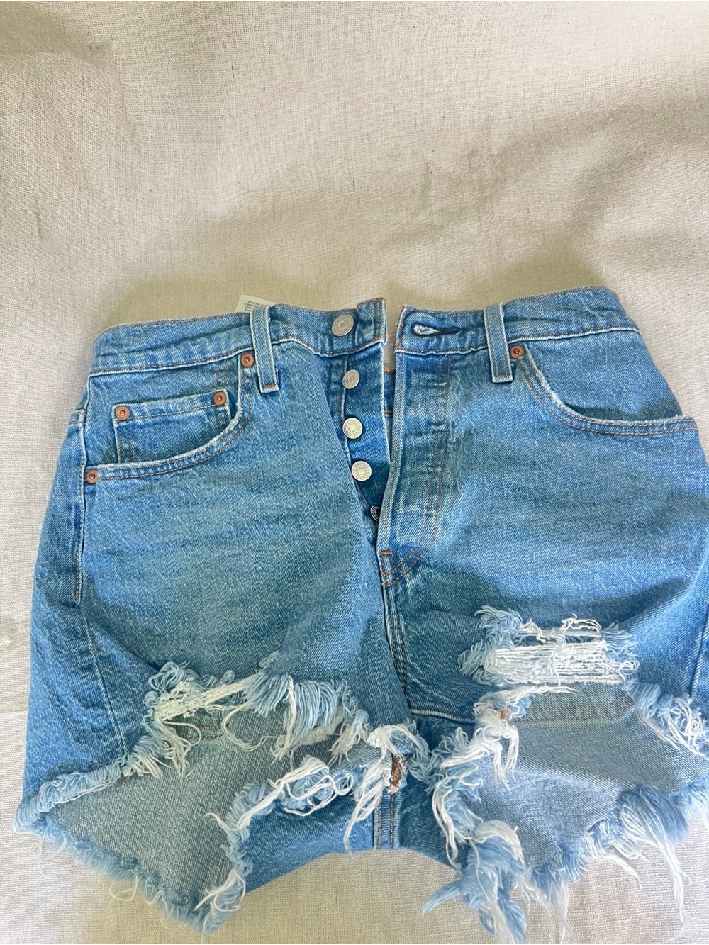 High-Waist Levi’s Waterless Distressed Denim Cutoff Shorts 28